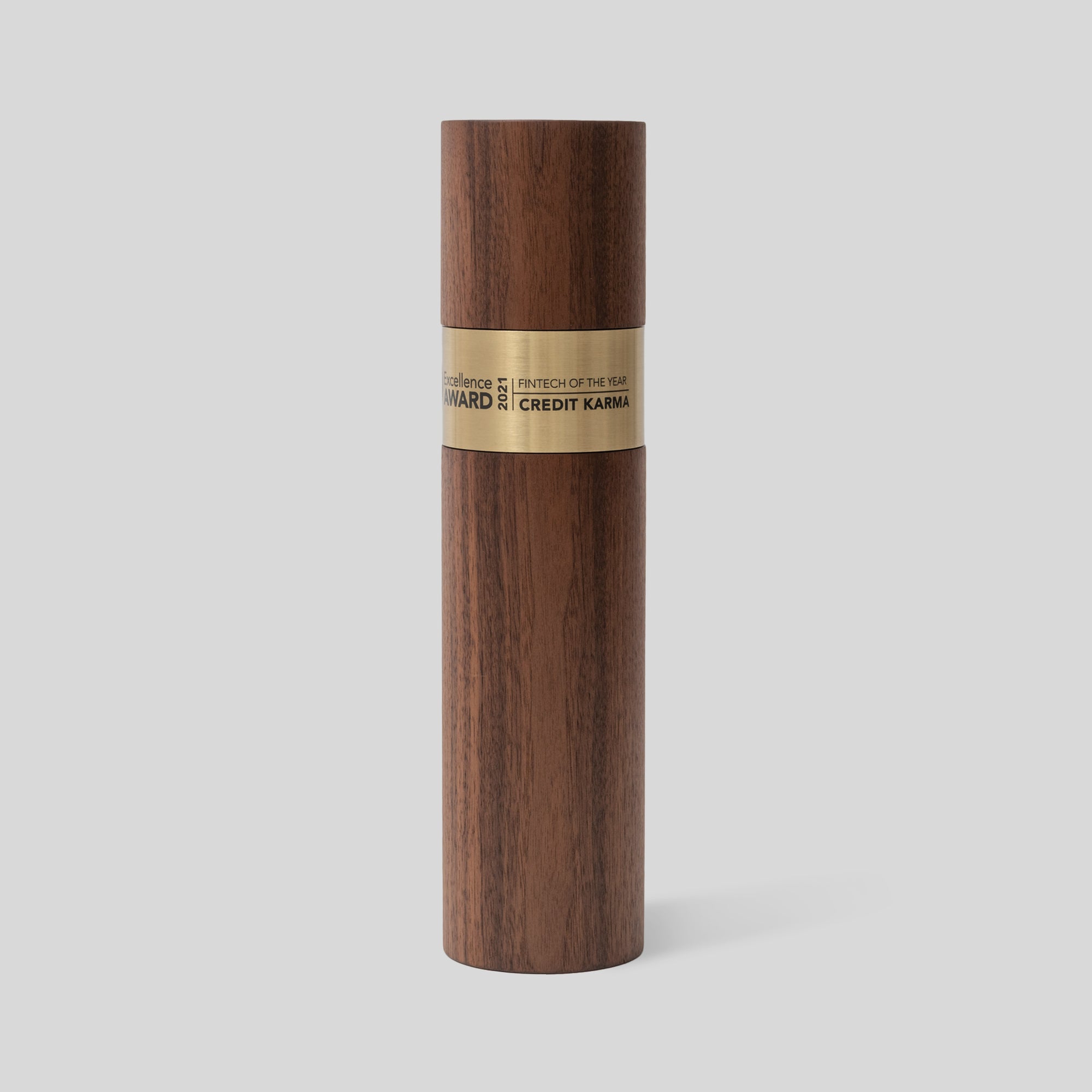 Stela Round Award | Medium: A wooden cylinder trophy with a brass metal ring, representing unity and excellence, artisan-crafted for meaningful recognition. Engraved and personalized.