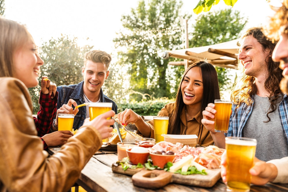 Business anniversary celebration — outdoor team picnic marking a company milestone