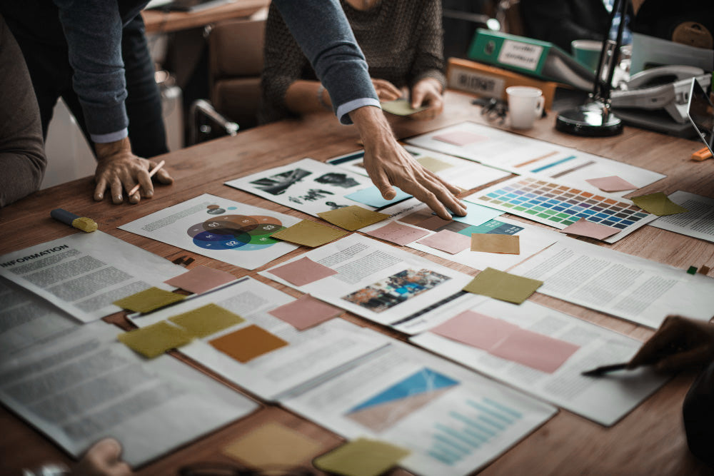 Employee recognition program planning session with sticky notes and frameworks, supporting a 90-day workplace recognition strategy