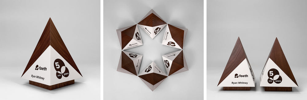 Pyramid-shaped wooden awards by Trophyology showcasing modern business anniversary award ideas for employee milestones and recognition
