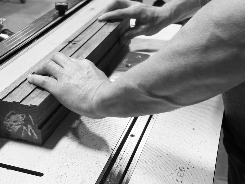 How a wooden trophy is made: Trophyology artisan routing walnut for a Stela Imperium award in the Austin woodshop