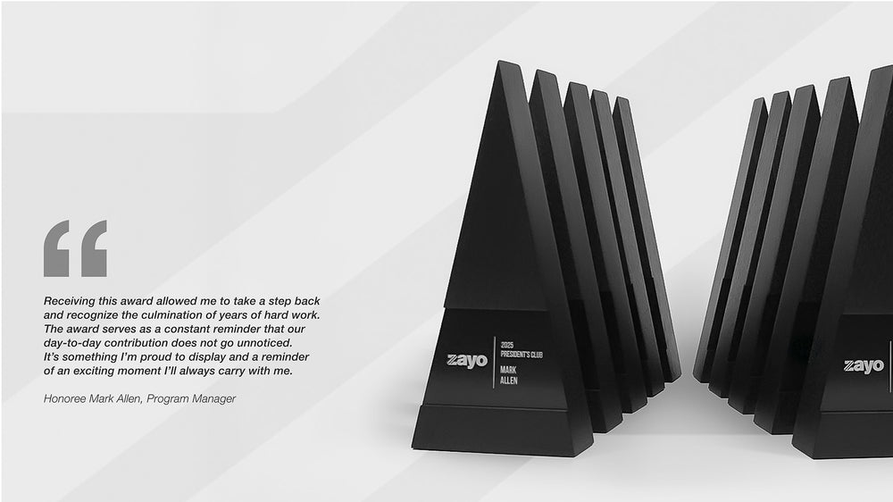 Custom Figura Trigonum Awards handcrafted by Trophyology for Zayo’s President’s Club, featuring ebony-stained North American walnut and modern geometric design.