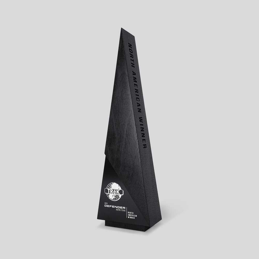Gracilia A-Line Award: Wooden triangular trophy with white text engraving, embodying luxury recognition design and customizable features for corporate recognition and personalized expression.