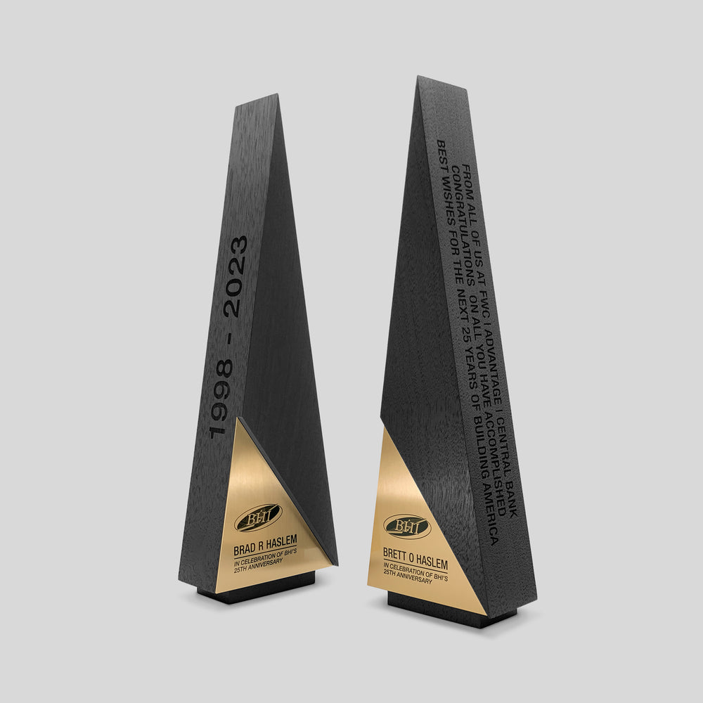 Gracilia A-Line Awards, featuring ebony-stained wood and metal trophies with customizable engraving elements, reflecting luxury and personalized recognition ideal for clients and employee appreciation. 