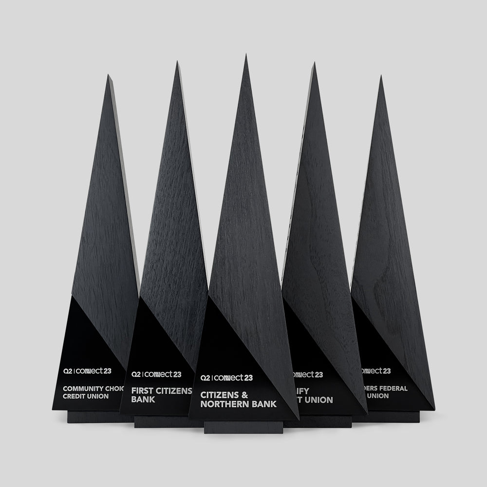 Gracilia A-Line Executive Awards: A modern black triangular wood trophy design inspired by high fashion, ideal for personalized corporate recognition, client appreciation or deal toys.