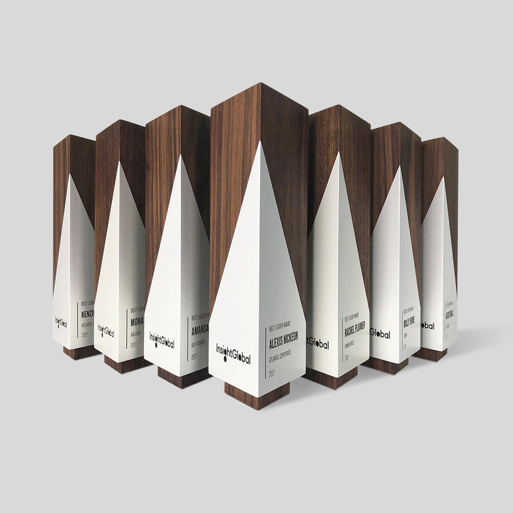 Geometria Award Triangulus, a minimalist wooden trophy with angular lines, embodies precision and excellence, crafted from walnut or maple, ideal for personalized engraving.