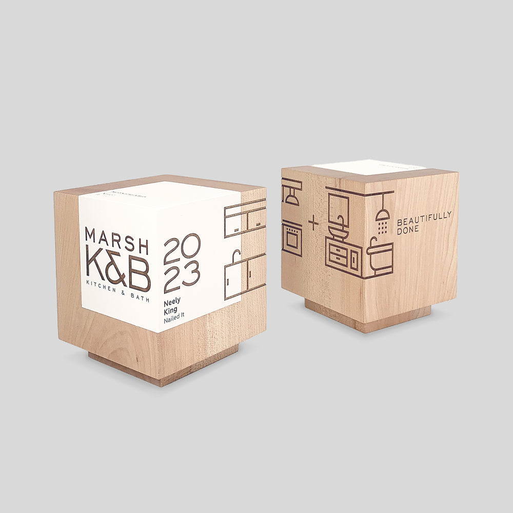 Geometria Award Cubus - two wood trophy cubes, exemplifying minimalist design and engraved personalization, crafted from solid walnut or maple. Architect-designed and artisan-crafted in the USA. 