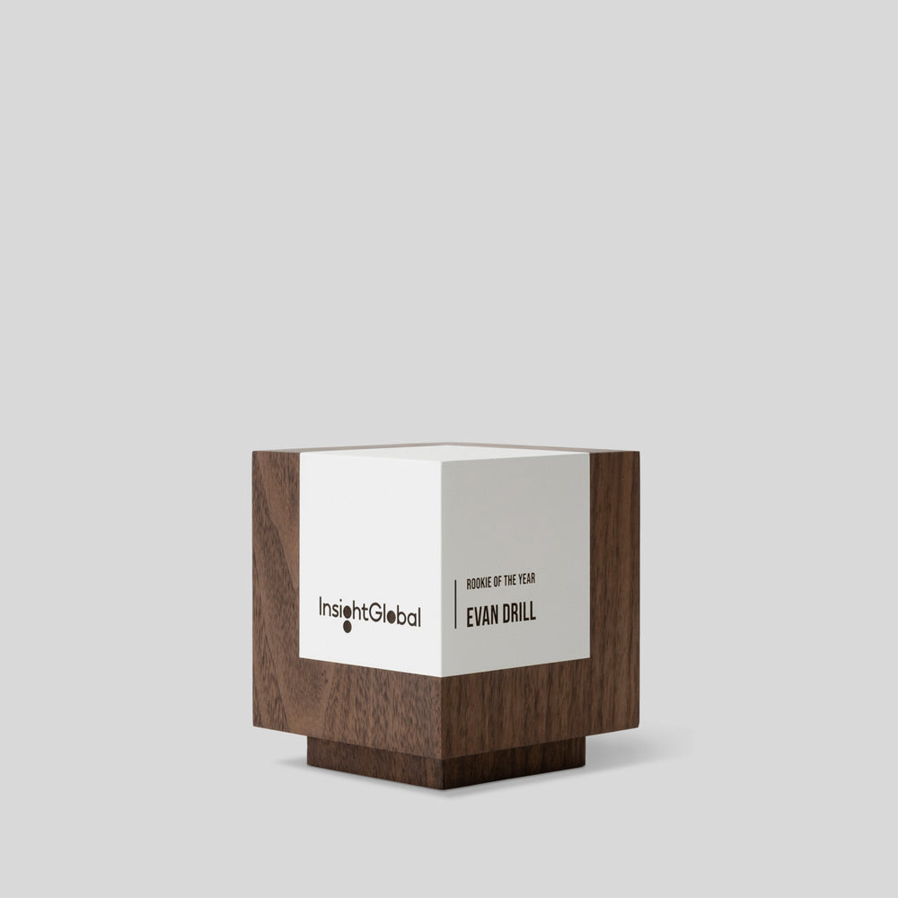 Geometria Award Cubus, a minimalist wood cube with engraving, symbolizing stability and excellence, crafted from solid walnut or maple. Architect-designed and artisan-crafted in the USA. 