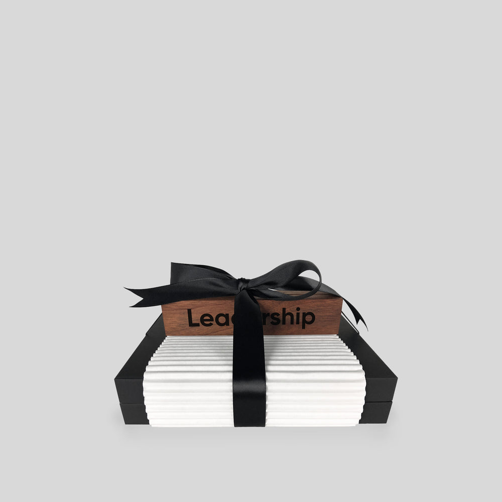 Inspirational Desk Card Collection with a black ribbon, wooden stand, and art cards, elegantly packaged for a delightful unboxing experience.