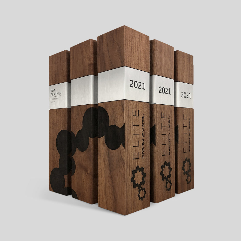 Elegant executive awards crafted from walnut wood with engraved designs and brushed metal nameplates. A sophisticated client recognition for top partners and excellence.