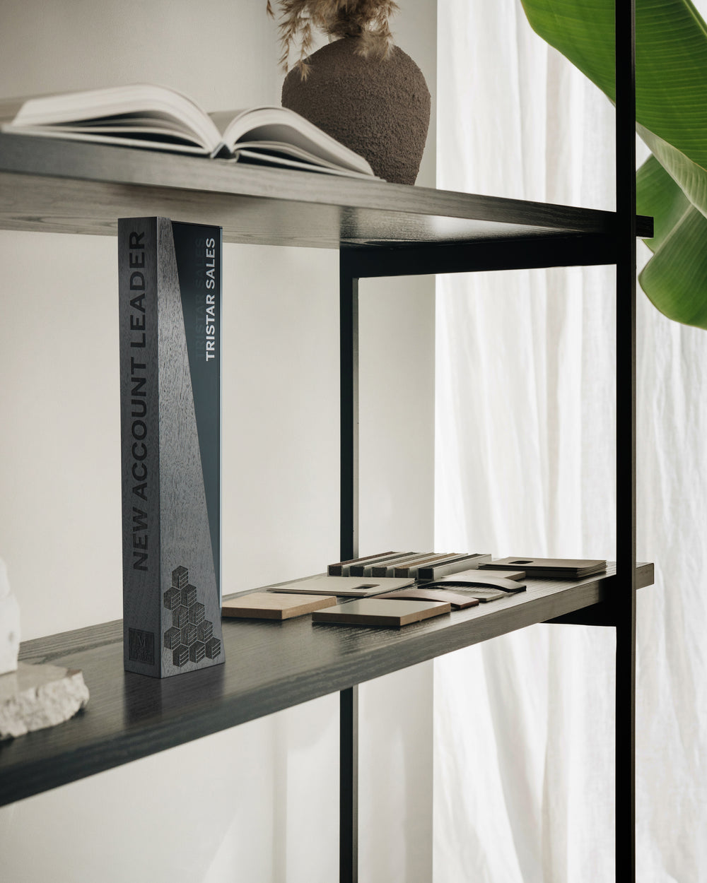 A modern executive award displayed on a stylish shelf, blending seamlessly with a refined interior. Crafted with precision, it celebrates leadership and achievement.