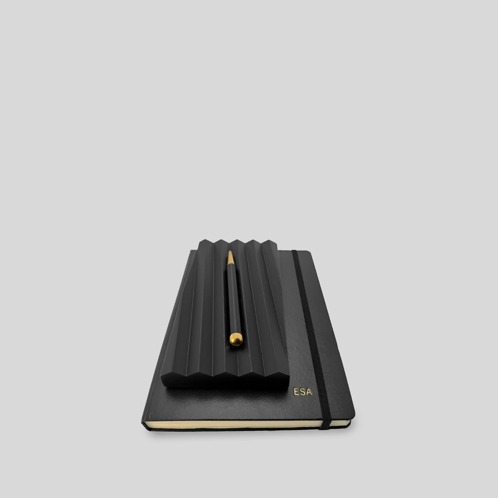 Curated business gift set 'thanking by hand' featuring a black embossed notebook with an elegant wood pen tray, quality pen, ideal for personalized, elegant corporate gifting.