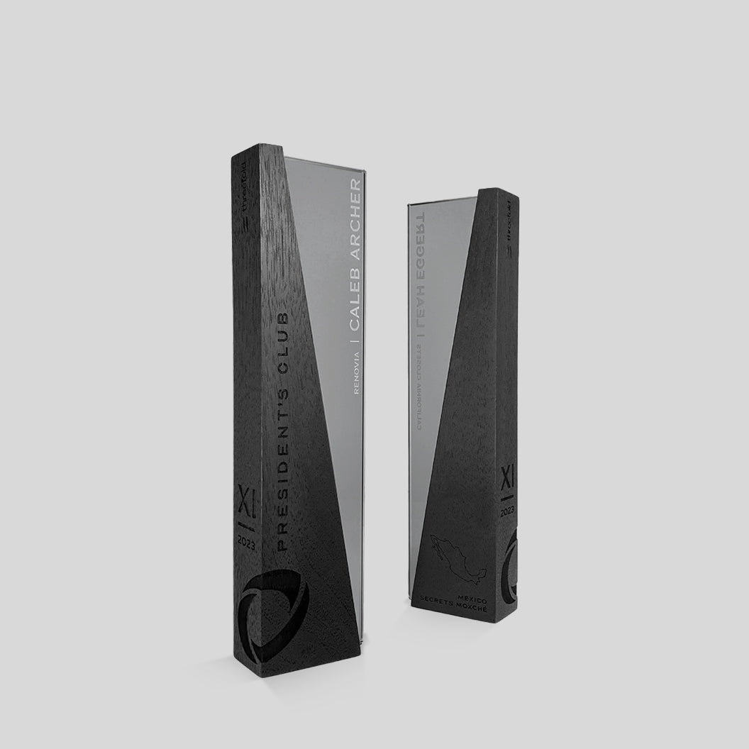 DI/MI Award | Small, featuring interlocking ebony-stained hardwood and dark grey glass, showcasing a sophisticated, angled design symbolizing unity and innovation.