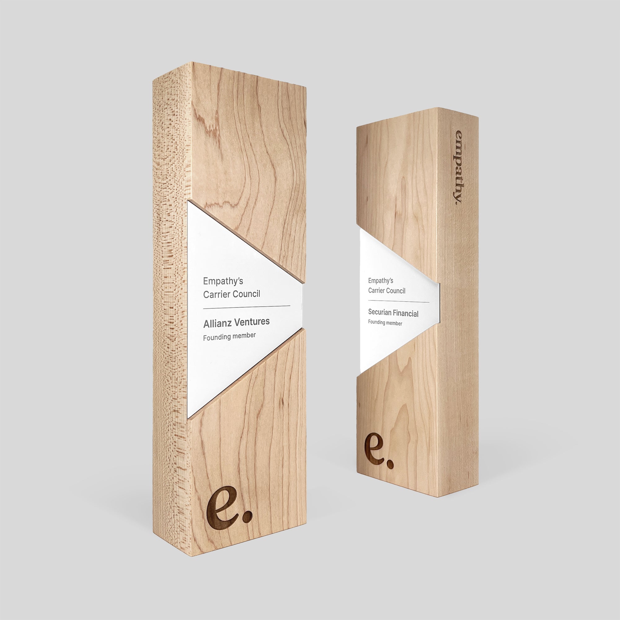 Figura Trapezium Award: a wooden trapezoidal award plaque in wood trophy with white metal accents, expertly crafted symbolizing leadership and resilience.