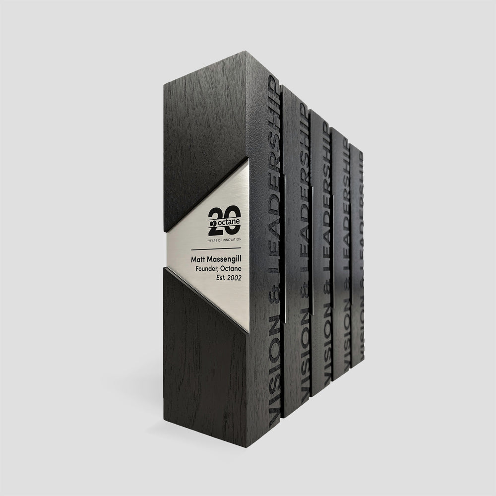 Figura Trapezium Award: a black rectangular award plaque with metal accent and engraving, symbolizing leadership and resilience for distinguished recognition.