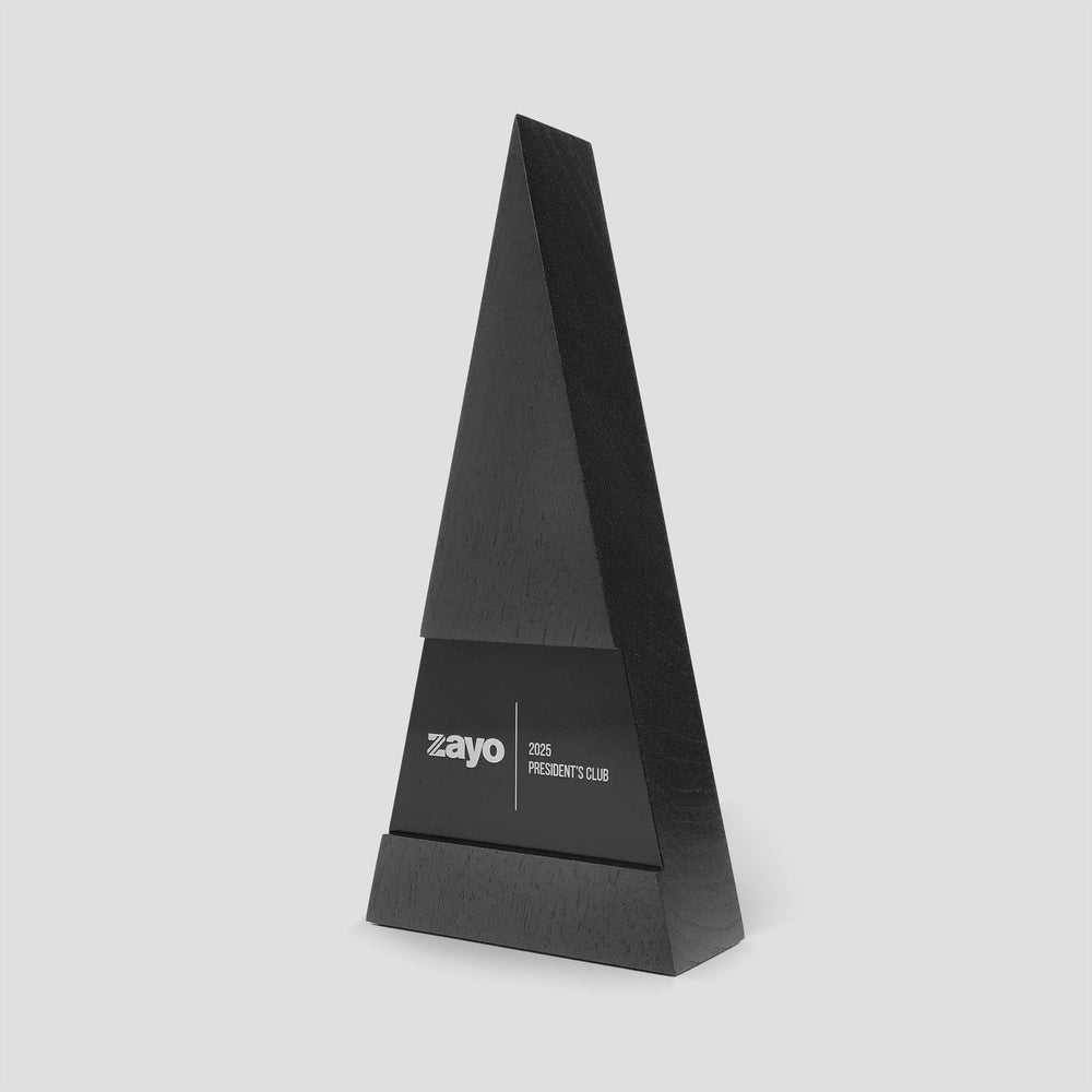 Show Award version of the Figura Trigonum design created by Trophyology for Zayo’s President’s Club, crafted in ebony-stained walnut for on-stage presentation impact.