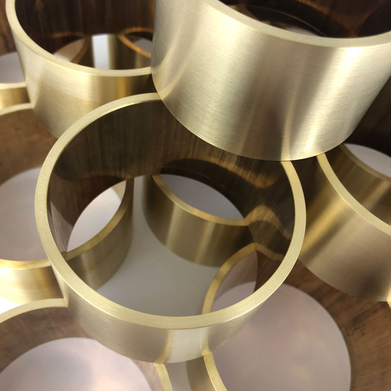 Brushed brass rings stacked for engraving of corporate trophies