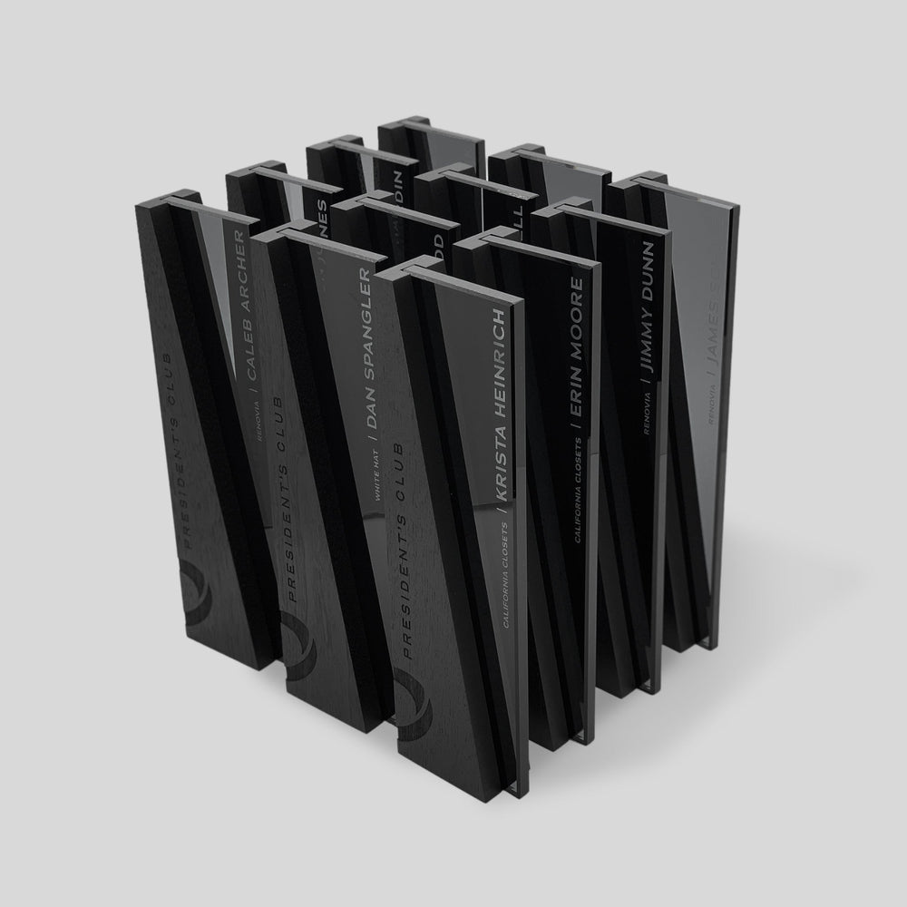 Unique glass and wood corporate trophies from Trophyology’s DIMI Collection, custom-engraved with “President’s Club” for sales recognition.