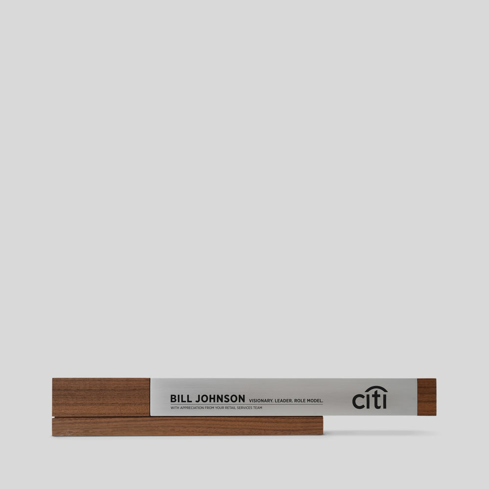 Fulgeo Award: A modern wood and metal engraved award plaque, featuring a cantilevered aluminum beam and a walnut base, symbolizing innovation and success, ideal for elegant executive recognition and lifetime achievement awards.