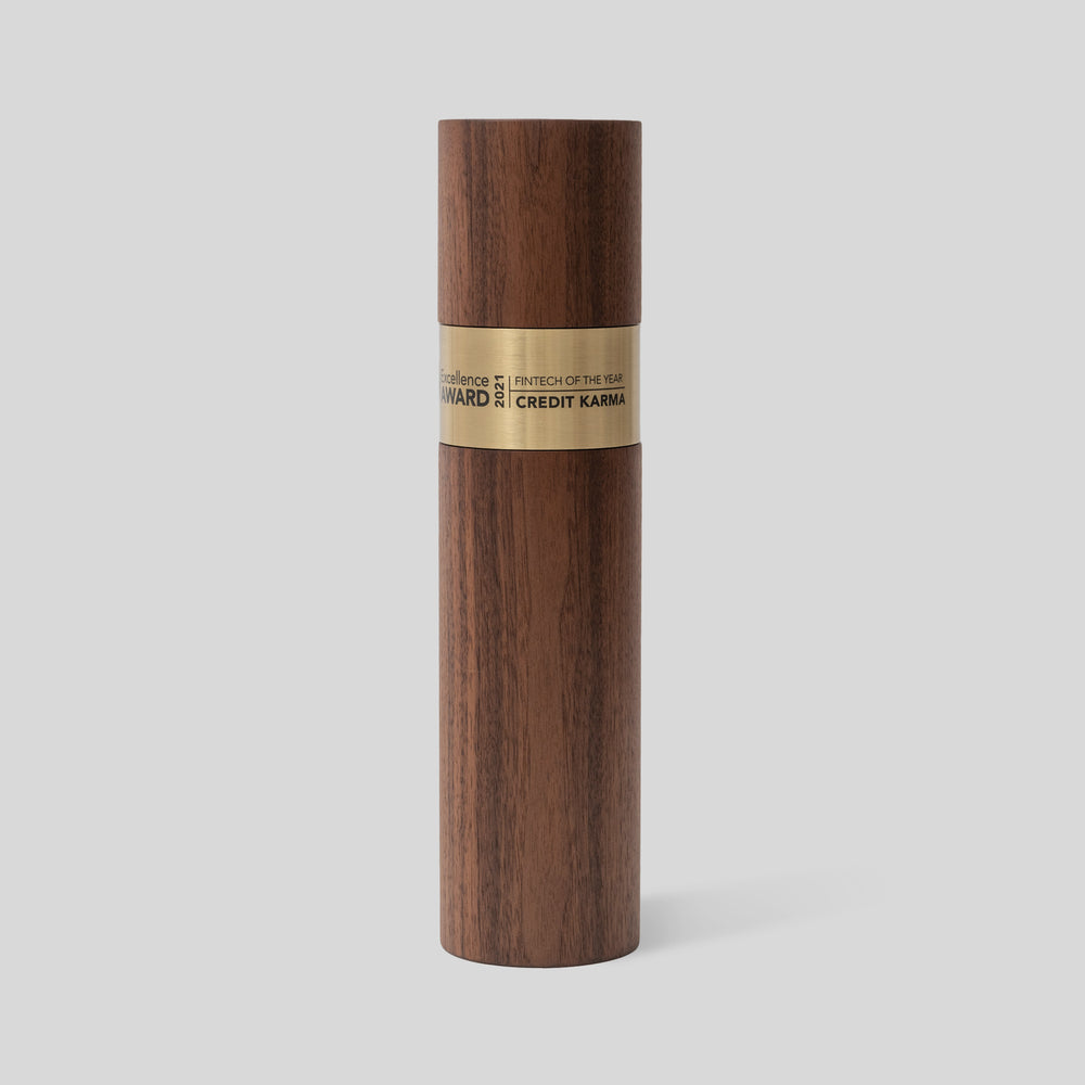 Stela Round Award | Medium: A wooden cylinder trophy with a brass metal ring, representing unity and excellence, artisan-crafted for meaningful recognition. Engraved and personalized.
