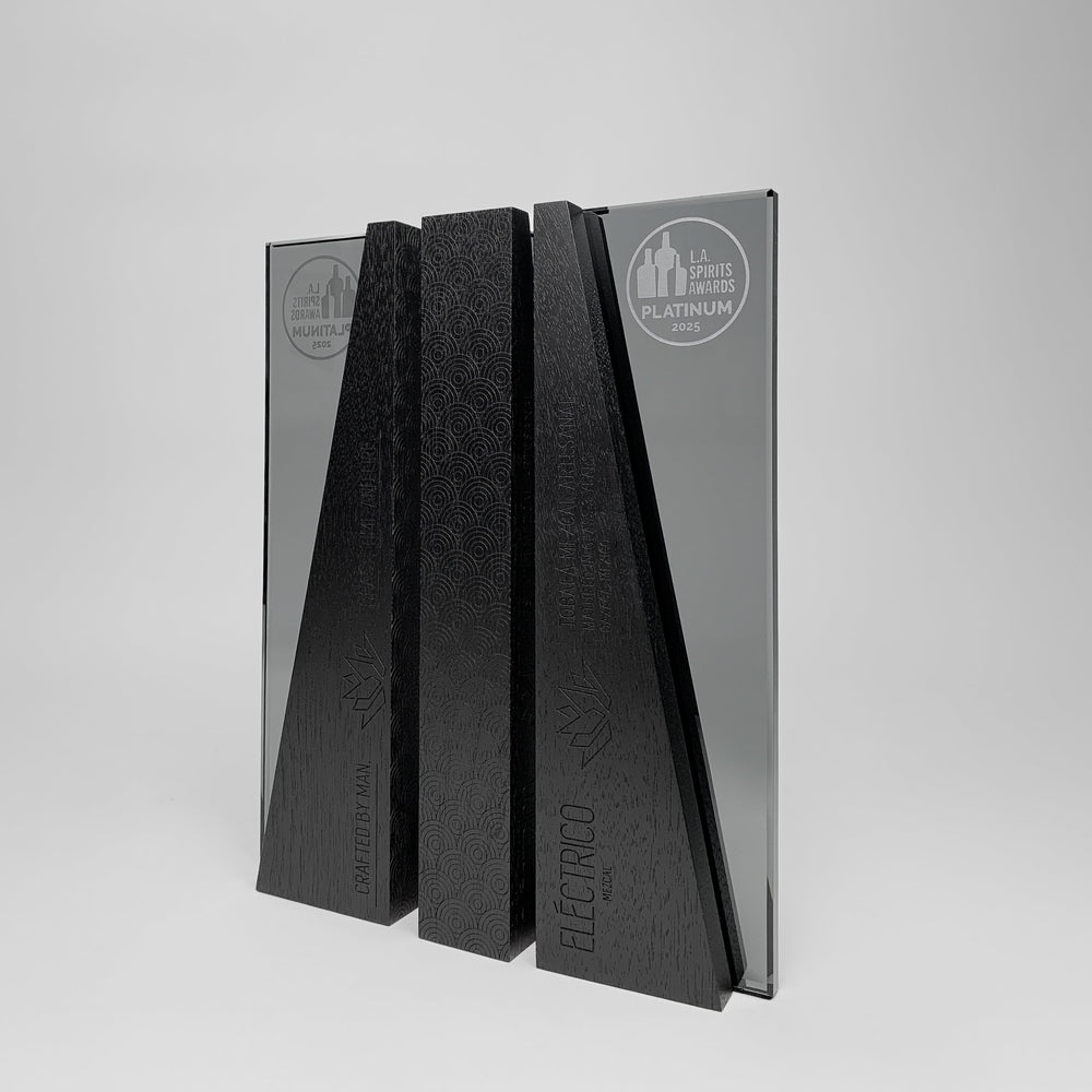 DIMI custom trophy by Trophyology, featuring wood and dark grey glass, engraved and personalized for the 2025 L.A. Spirits Awards winner Electrico Mezcal.