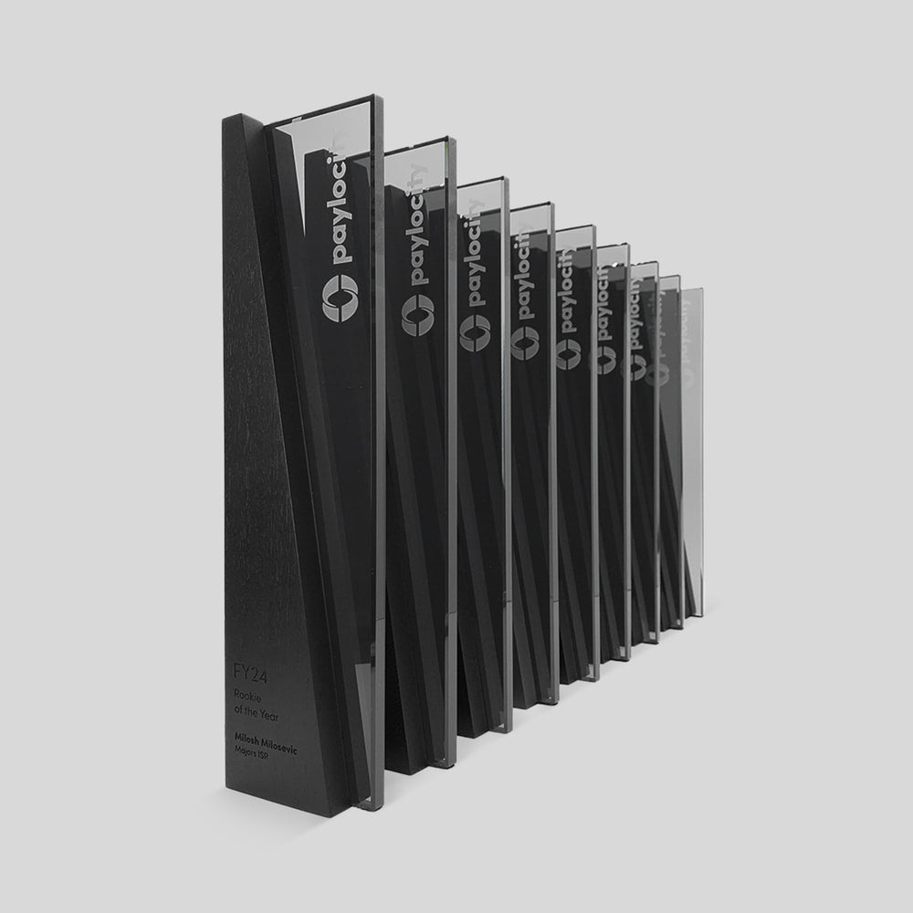 Series of corporate sales awards personalized and engraved for Paylocity with logo engraving in glass.