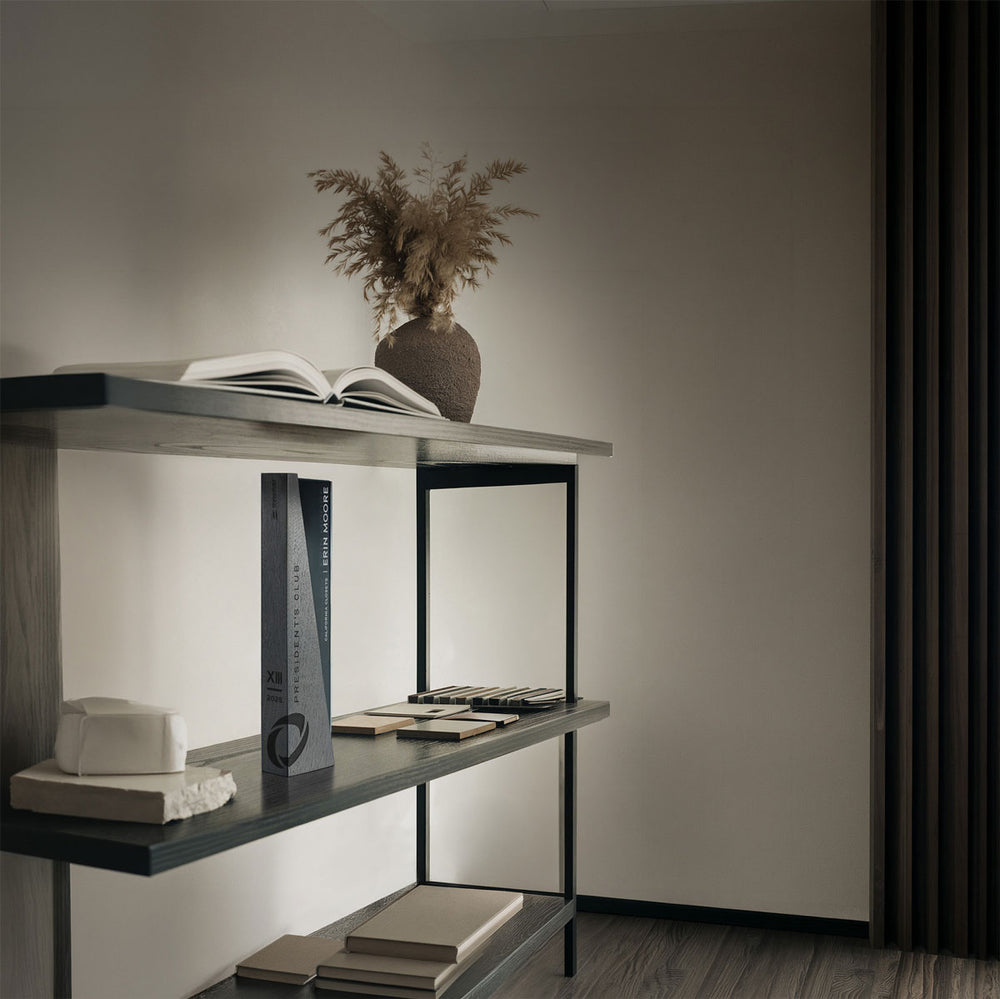President's Club award on a modern shelf crafted from glass and wood and personalized and laser-engraved