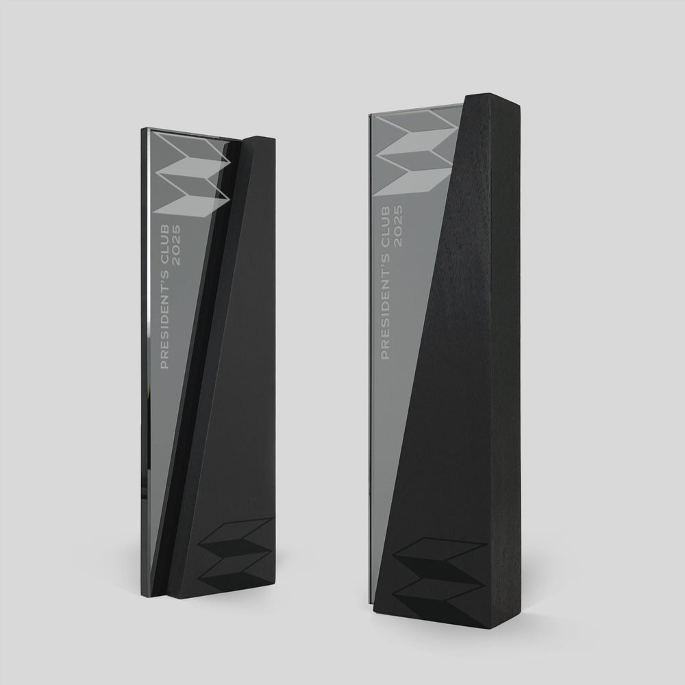 Modern glass and wood trophy from Trophyology’s DIMI Collection, custom-engraved with “President’s Club 2025” for sales recognition