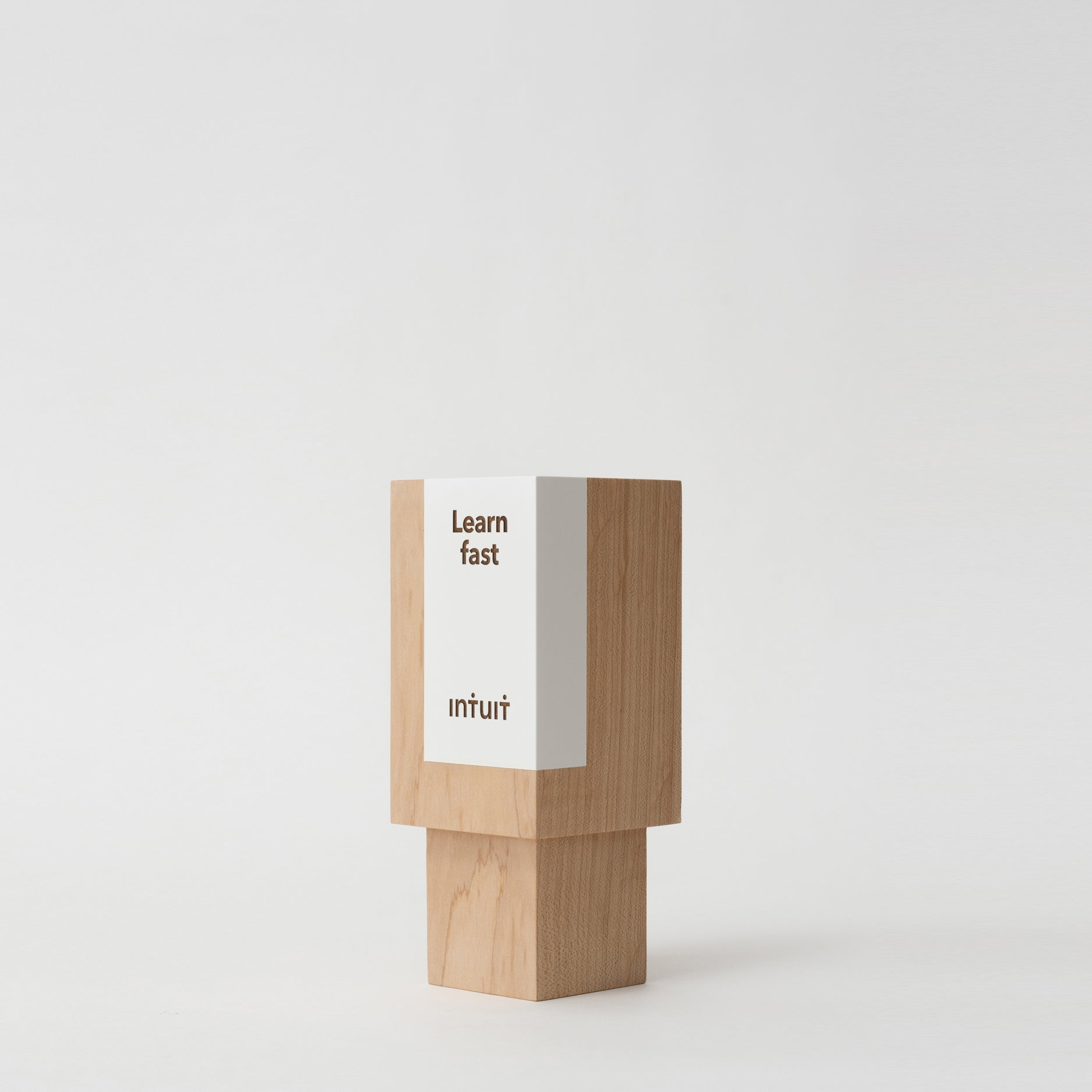 Geometria Award Rectangulus, a solid wood block with engraved minimalist design, showcasing geometric elegance and craftsmanship, part of Trophyology's artisan-crafted awards collection.