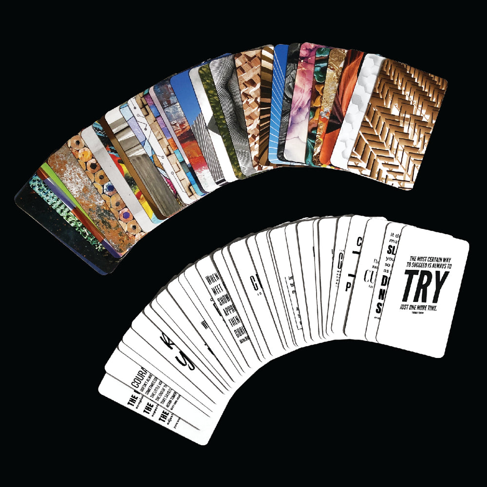 Inspirational Desk Card Collection displayed in a fan, featuring art and quotes, accompanied by a wood stand for an elegant office addition.