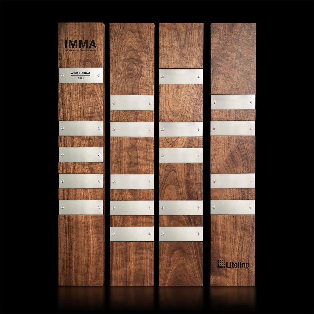 Perpetual Plaques | Walnut: A set of wood plaque modules with silver metal nameplates, designed for engraving and personalization on wood and metal, featuring stainless steel fasteners for periodic updates to the honoree nameplates.